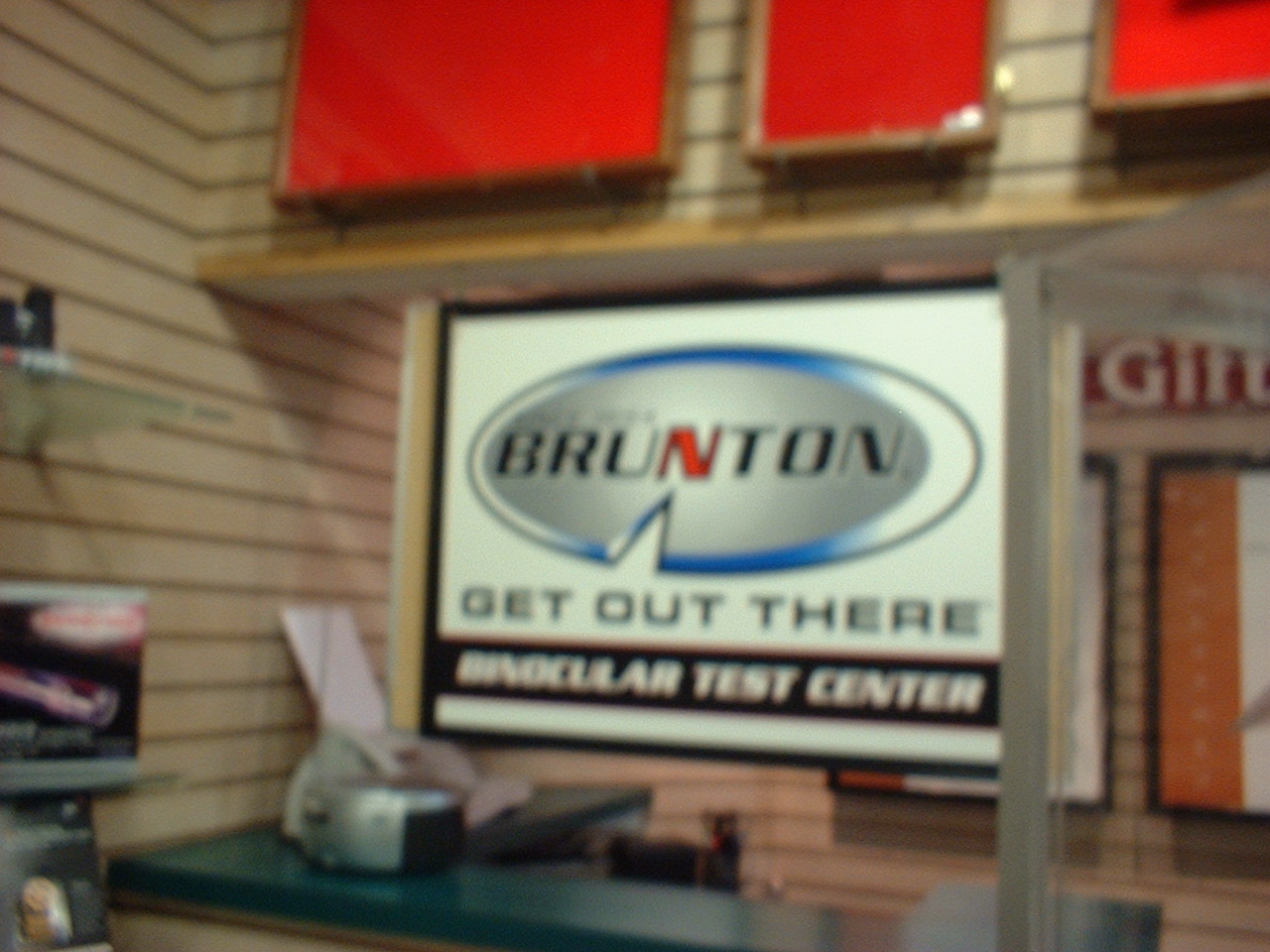 A blurry sign outside what appears to be a binocular testing center.